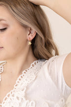 Puzzle Piece Huggie Hoops by Rose & Clay