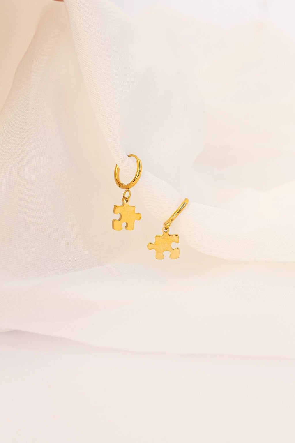 Puzzle Piece Huggie Hoops by Rose & Clay