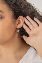 Puzzle Piece Huggie Hoops by Rose & Clay