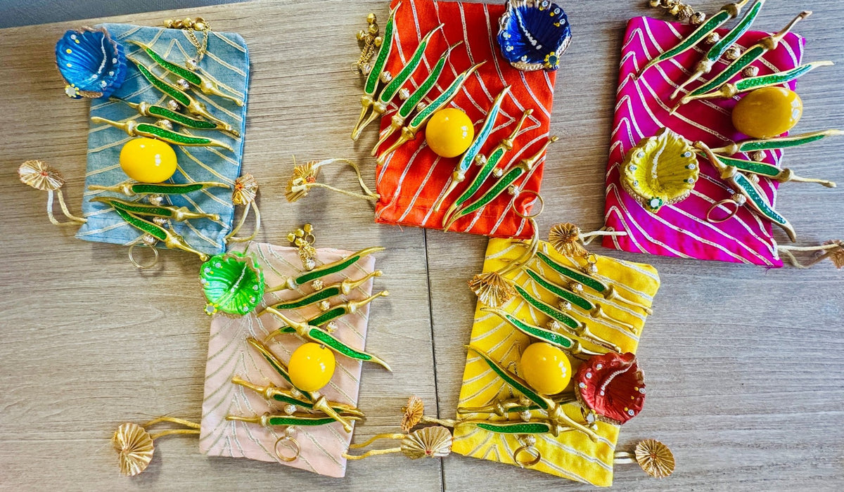 Ready-to-gift Combo Set includes One Metal Yellow & Green Nimbu Mirchi Charm & One Hand painted Clay Diya with Potli Gift Bag Set of 5 for Diwali or Indian Festivals or Occasions as Return Gift Favors & Return Gifts La Vie Bien Ready-to-gift Combo Set includes One Metal Yellow & Green Nimbu Mirchi Charm & One Hand painted Clay Diya with Potli Gift Bag Set of 5 for Diwali or Indian Festivals or Occasions as Return Gift