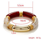 Red Acrylic Bangle by Curated By Suarez