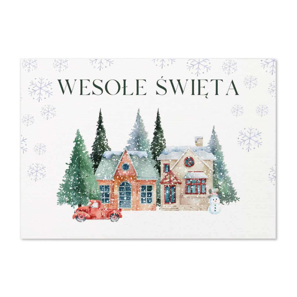 Polish Christmas greeting card featuring "Wesołe Święta" text with watercolor illustration of snowy village scene with cottages, pine trees, snowman, and vintage truck surrounded by delicate snowflake pattern, displayed with white envelope