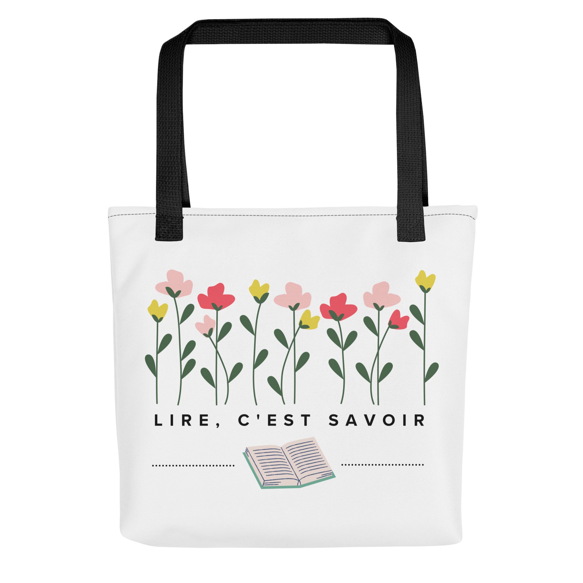 White canvas tote bag with black handles featuring hand-drawn pink, coral, and yellow flowers with green stems at top, French text "LIRE, C'EST SAVOIR" (to read is to know) in center, and small open book illustration at bottom