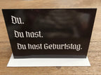 Du hast Geburtstag funny dry humor German birthday Greeting card, blank inside with envelope