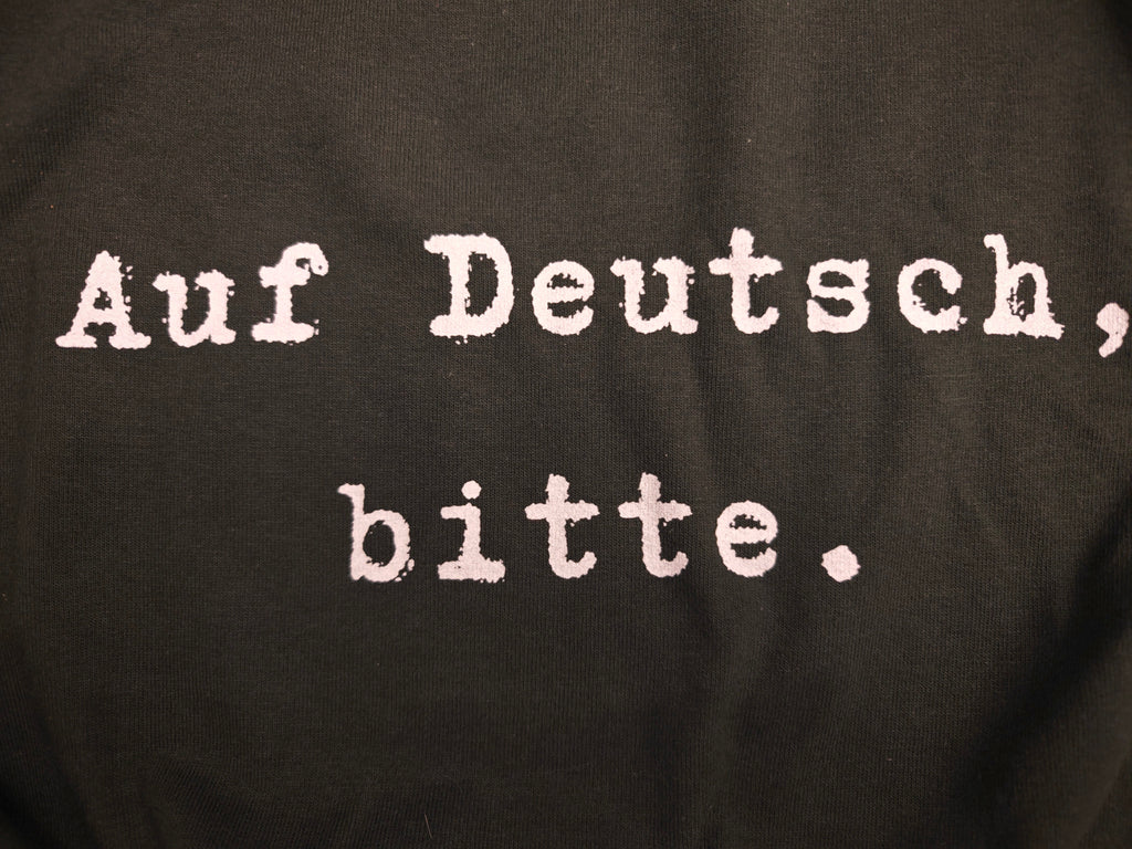 Auf Deutsch, bitte. German Language Tee Shirt, typewriter font Gildan 5000