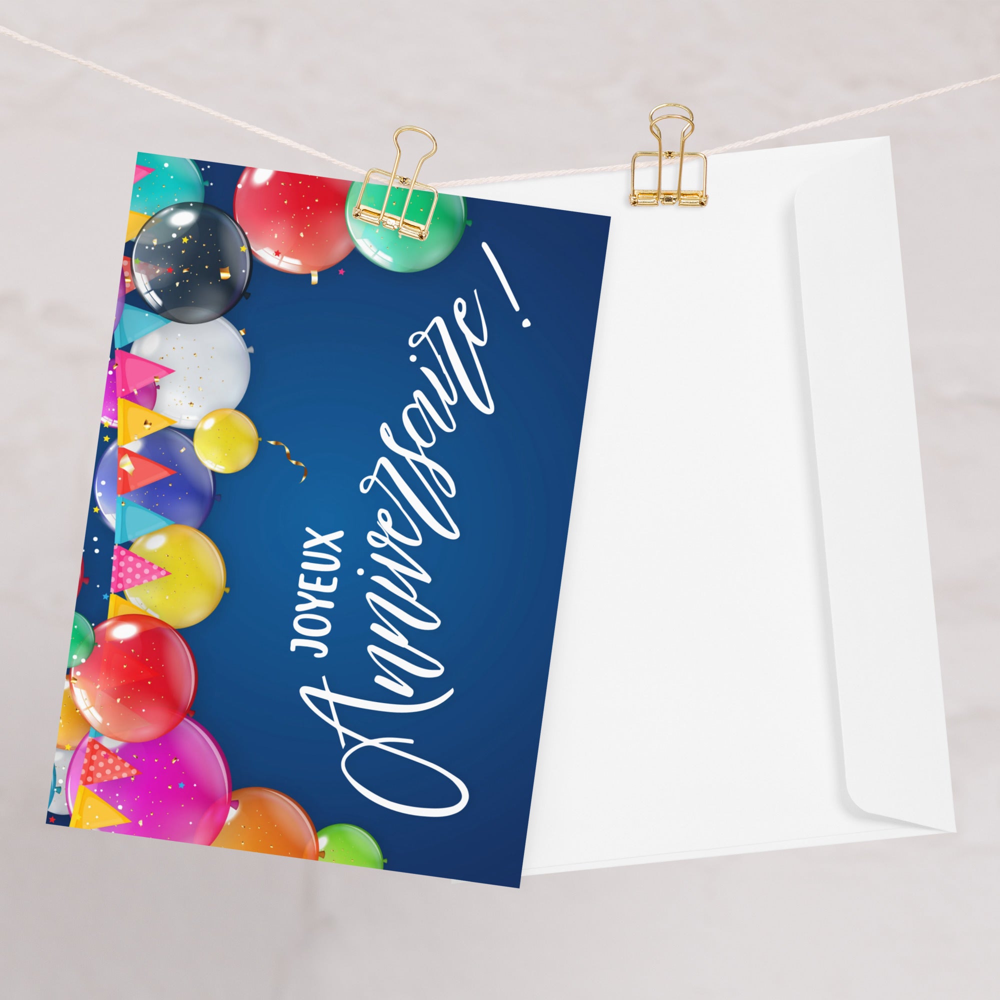 French birthday greeting card featuring "Joyeux Anniversaire" text in white script on navy blue background, decorated with colorful balloons in pink, red, yellow, green, purple, and blue, along with festive bunting banners and confetti