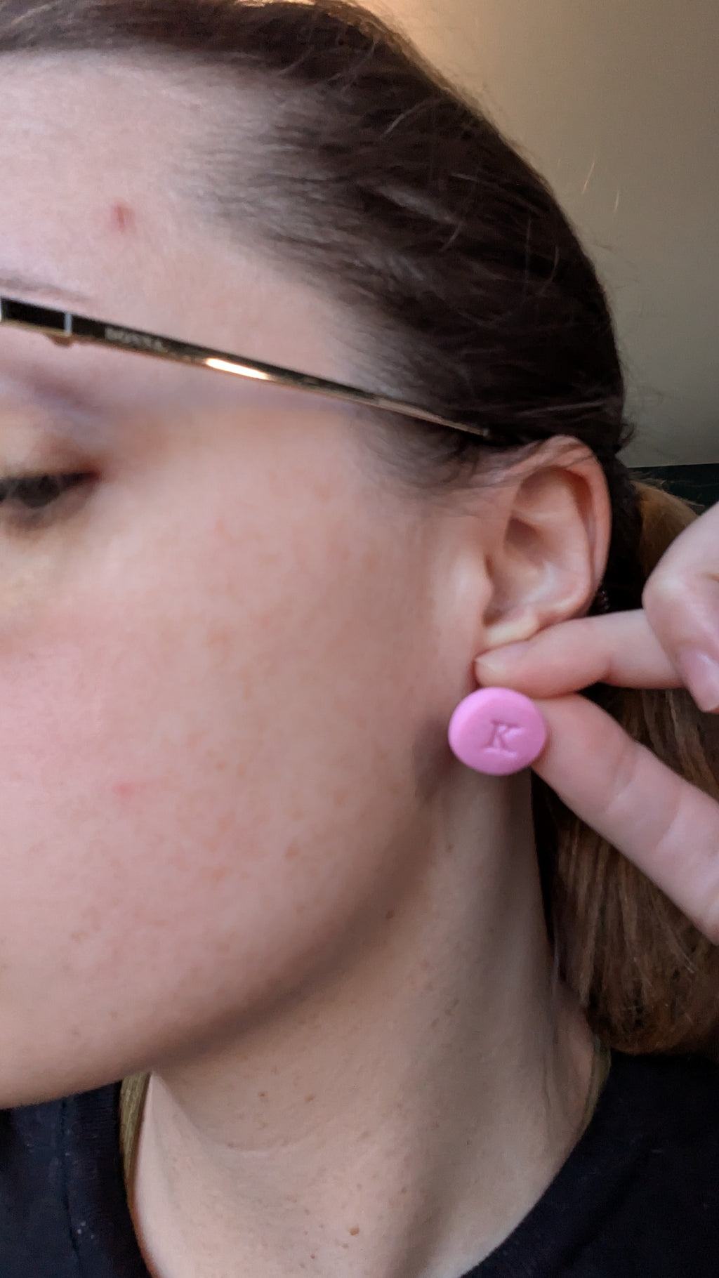 Pink K initial stud earrings