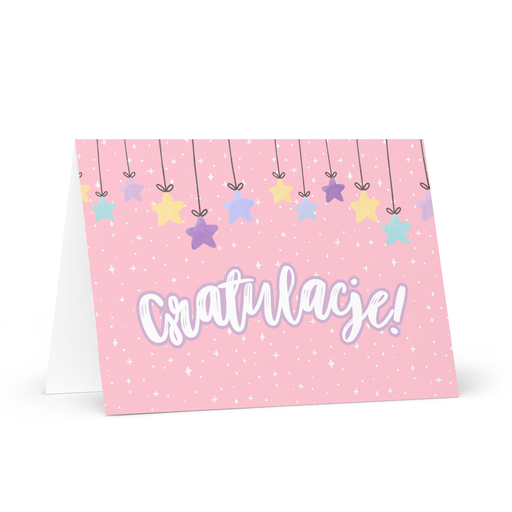 Polish greeting card with pink background featuring "Gratulacje!" text in white script lettering, decorated with hanging colorful stars and small sparkle details throughout