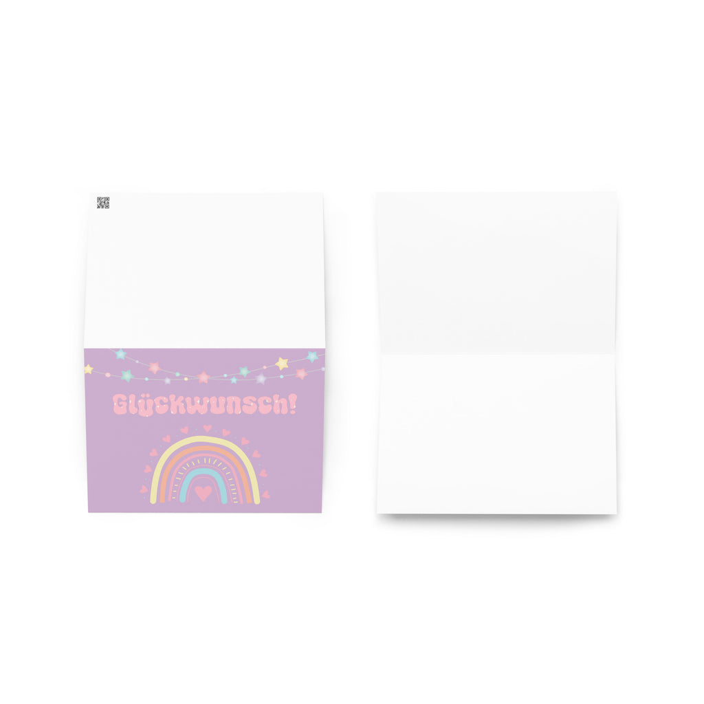 German greeting card with purple background featuring "Glückwunsch!" text in pink bubble letters, decorated with a pastel rainbow, colorful star garland, and small heart details