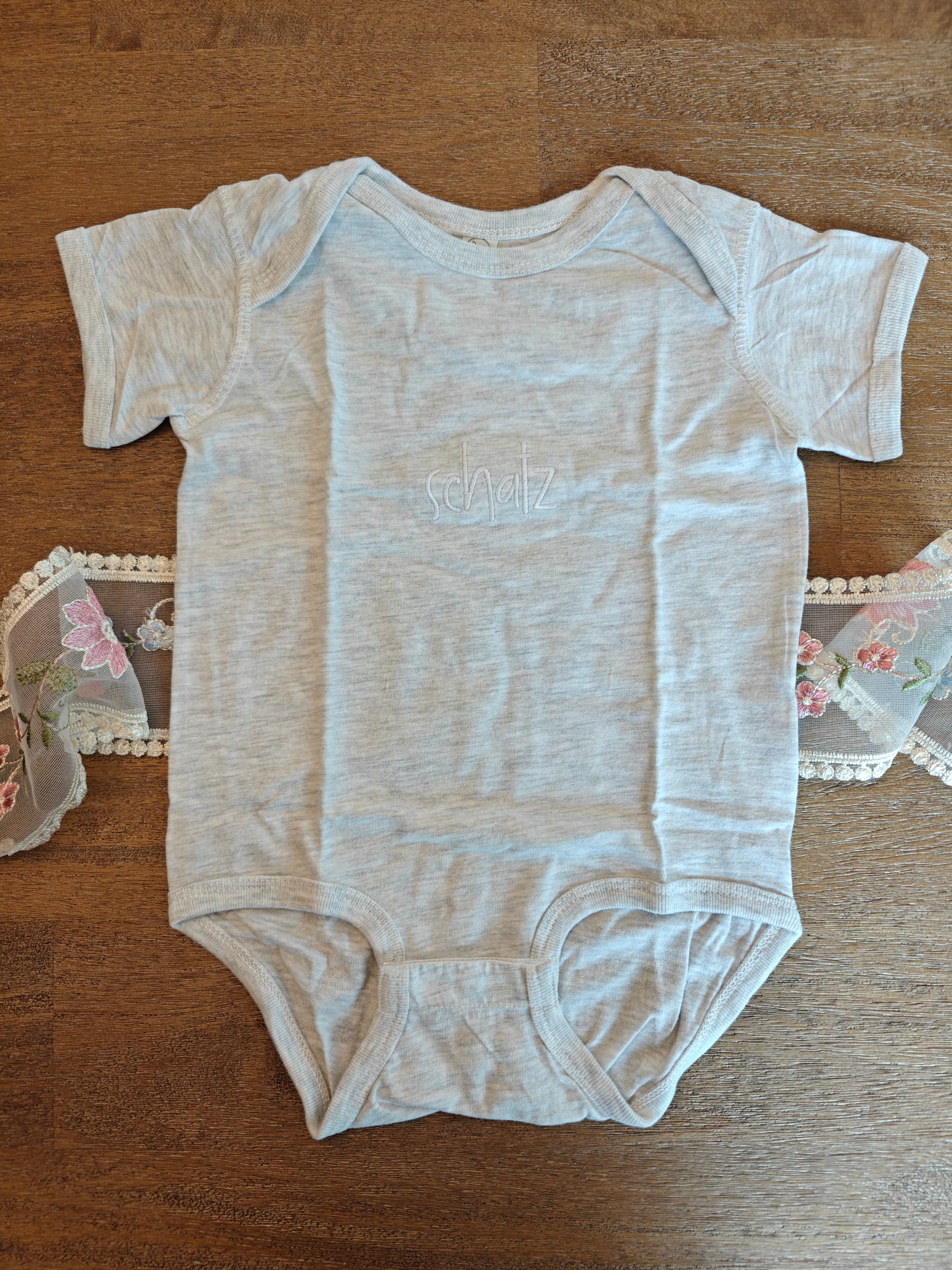 Schatz German "treasure" embroidered Baby jersey bodysuit, newborn gift for German speaking family