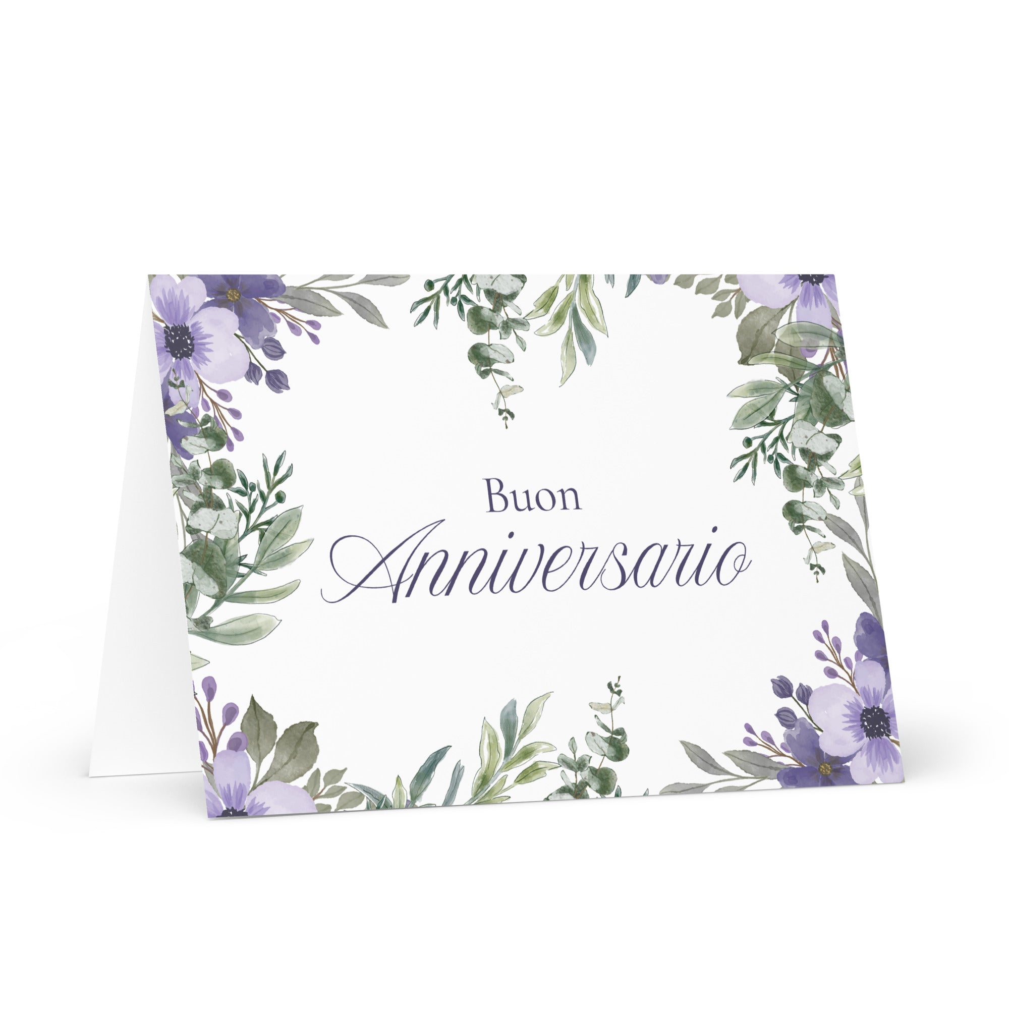 Italian anniversary greeting card featuring "Buon Anniversario" text in elegant script on white background, decorated with watercolor purple flowers and green botanical leaves in corner arrangement