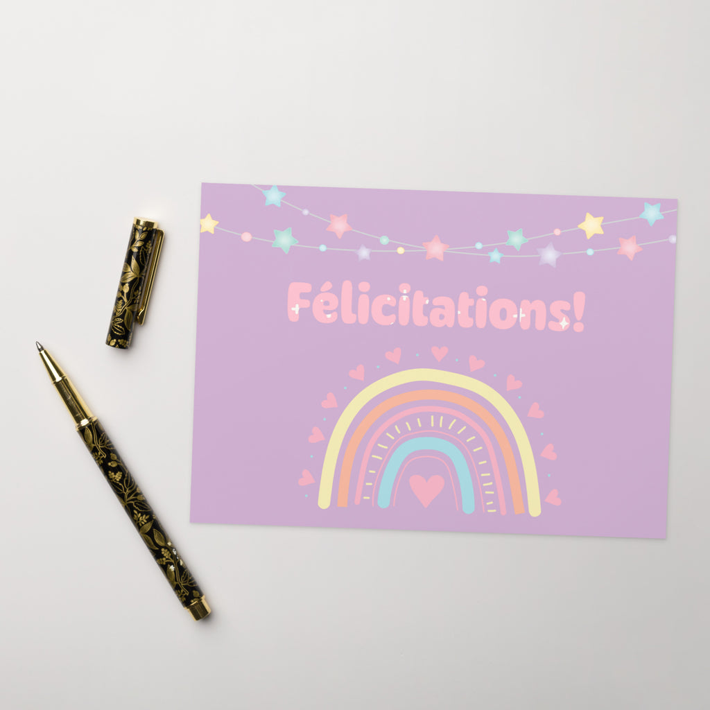 French greeting card with purple background featuring "Félicitations!" text in pink letters, decorated with a pastel rainbow, colorful star garland, and small heart details