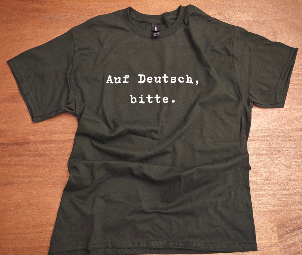 Auf Deutsch, bitte. German Language Tee Shirt, typewriter font Gildan 5000