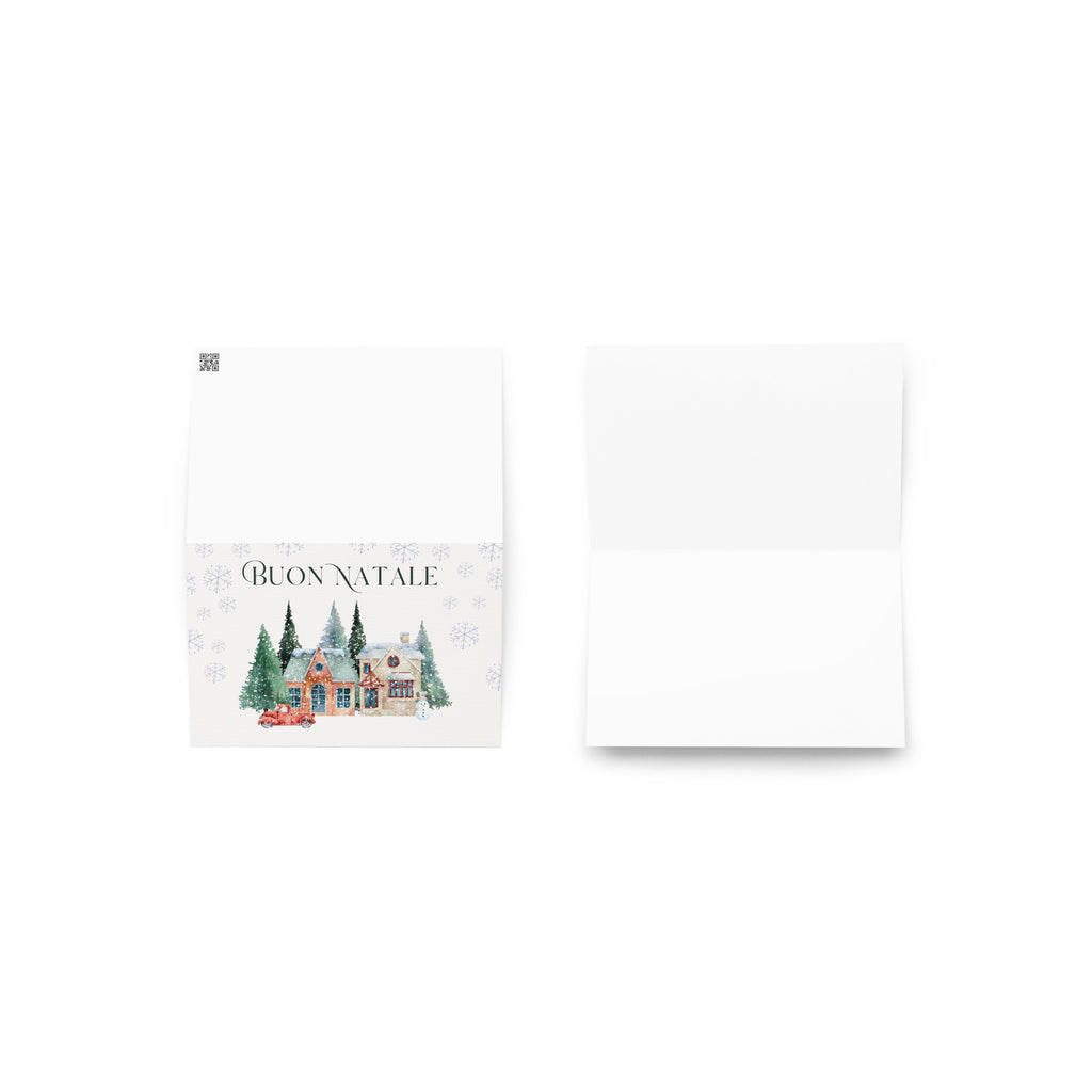 Italian Christmas greeting card featuring "Buon Natale" text with watercolor illustration of snowy village scene with cottages, pine trees, snowman, and vintage truck surrounded by delicate snowflake pattern