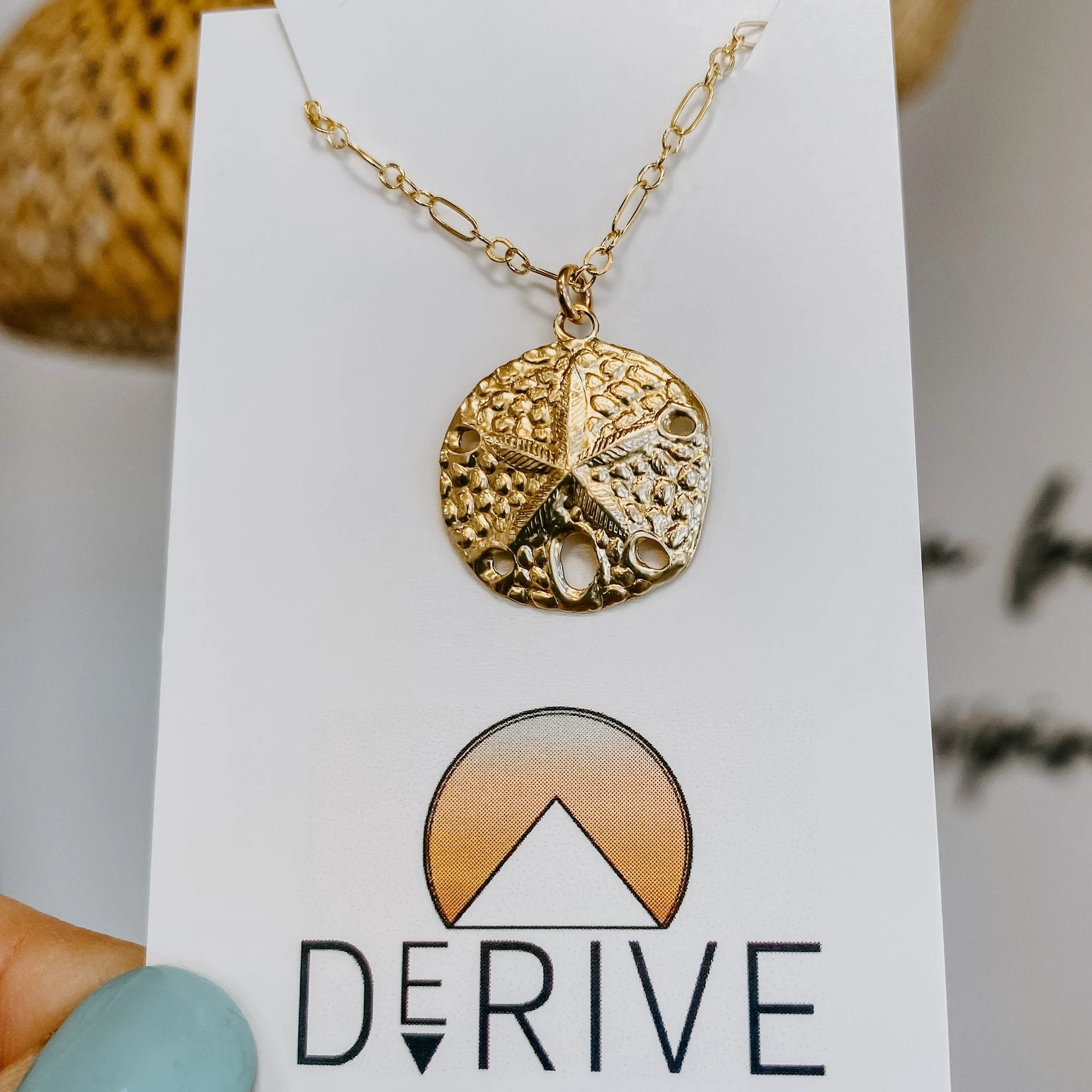 Sand Dollar Pendant Necklace by Derive Jewelry
