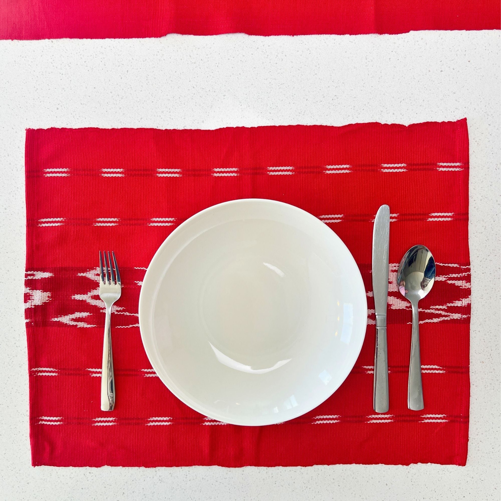 Serpentine Ikat Woven Placemat - Cherry Siggy La Vie Bien Serpentine Ikat Woven Placemat - Cherry
