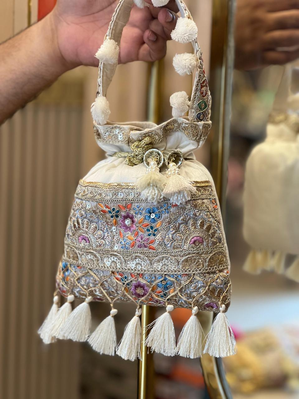 Silk Potli Bag with Hand Embroidery, Pom Pom & Tassels La Vie Bien Silk Potli Bag with Hand Embroidery, Pom Pom & Tassels