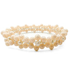 Socialite crystal flower and pearl bangle bracelet by Alegria Accessories Inc