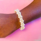 Socialite crystal flower and pearl bangle bracelet by Alegria Accessories Inc