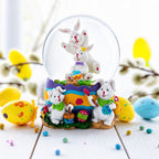 Spring Easter Egg Painting Rabbits Music Box Snow Globe 6 Inches Tall Easter > Water Globes > Bunnies La Vie Bien Spring Easter Egg Painting Rabbits Music Box Snow Globe 6 Inches Tall