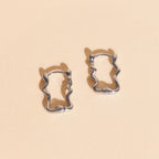 Squiggly Rounded Huggie Hoop Earrings by Oh Clementine