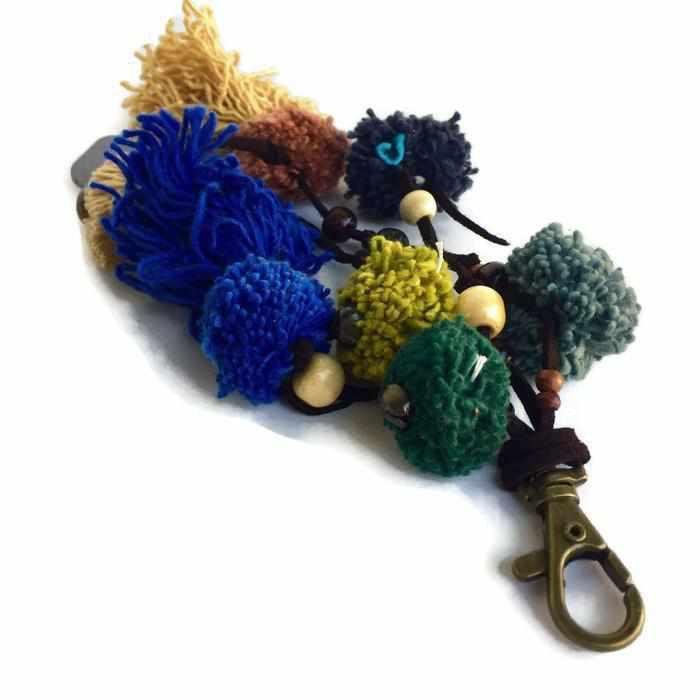 Suerte Pom Pom Zipper Pull with Beads, Shells, and Charms | Handmade Keychain | Thailand Zipper Pulls La Vie Bien Suerte Pom Pom Zipper Pull with Beads, Shells, and Charms | Handmade Keychain | Thailand