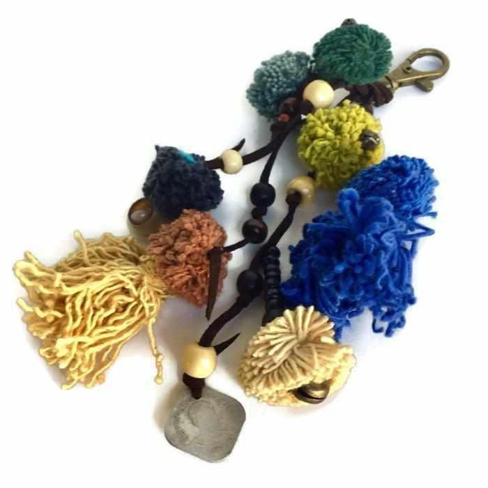 Suerte Pom Pom Zipper Pull with Beads, Shells, and Charms | Handmade Keychain | Thailand Zipper Pulls La Vie Bien Suerte Pom Pom Zipper Pull with Beads, Shells, and Charms | Handmade Keychain | Thailand