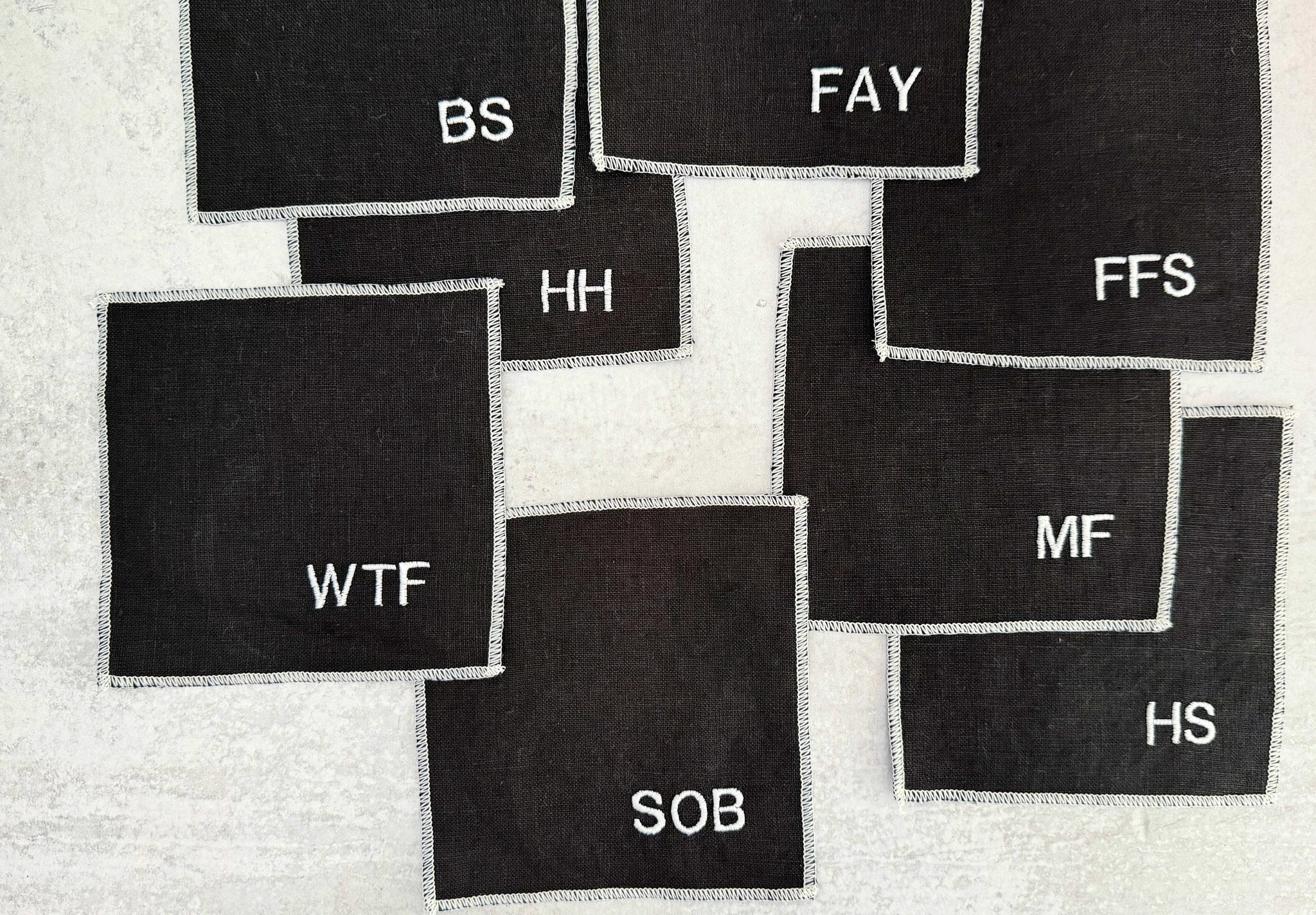 Sweary Cocktail Coasters in Black and White, set of eight by Dot and Army