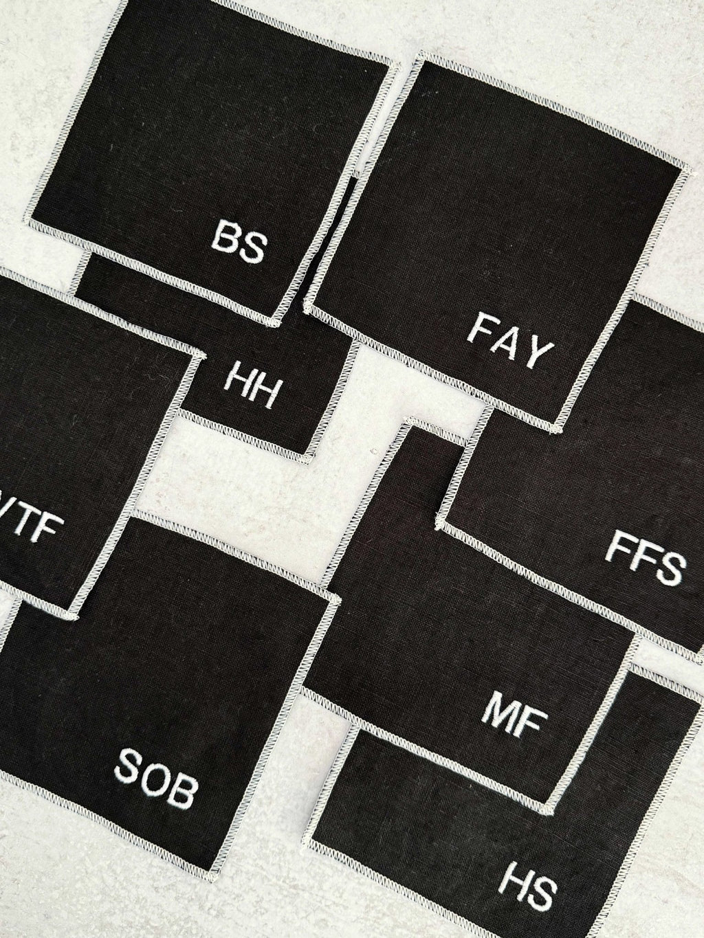 Sweary Cocktail Coasters in Black and White, set of eight by Dot and Army