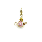 Tea gold charm by Alegria Accessories Inc