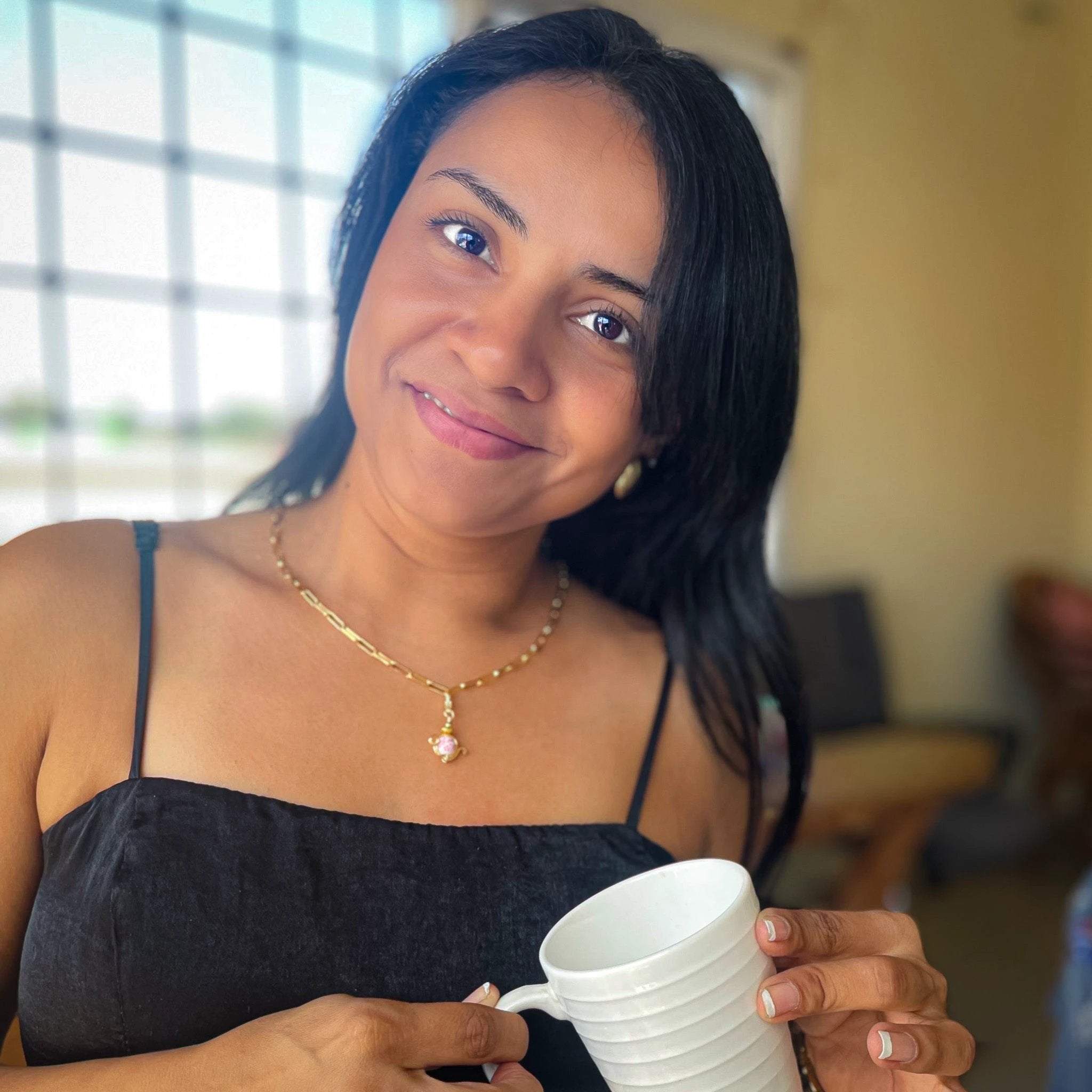 Tea gold charm by Alegria Accessories Inc