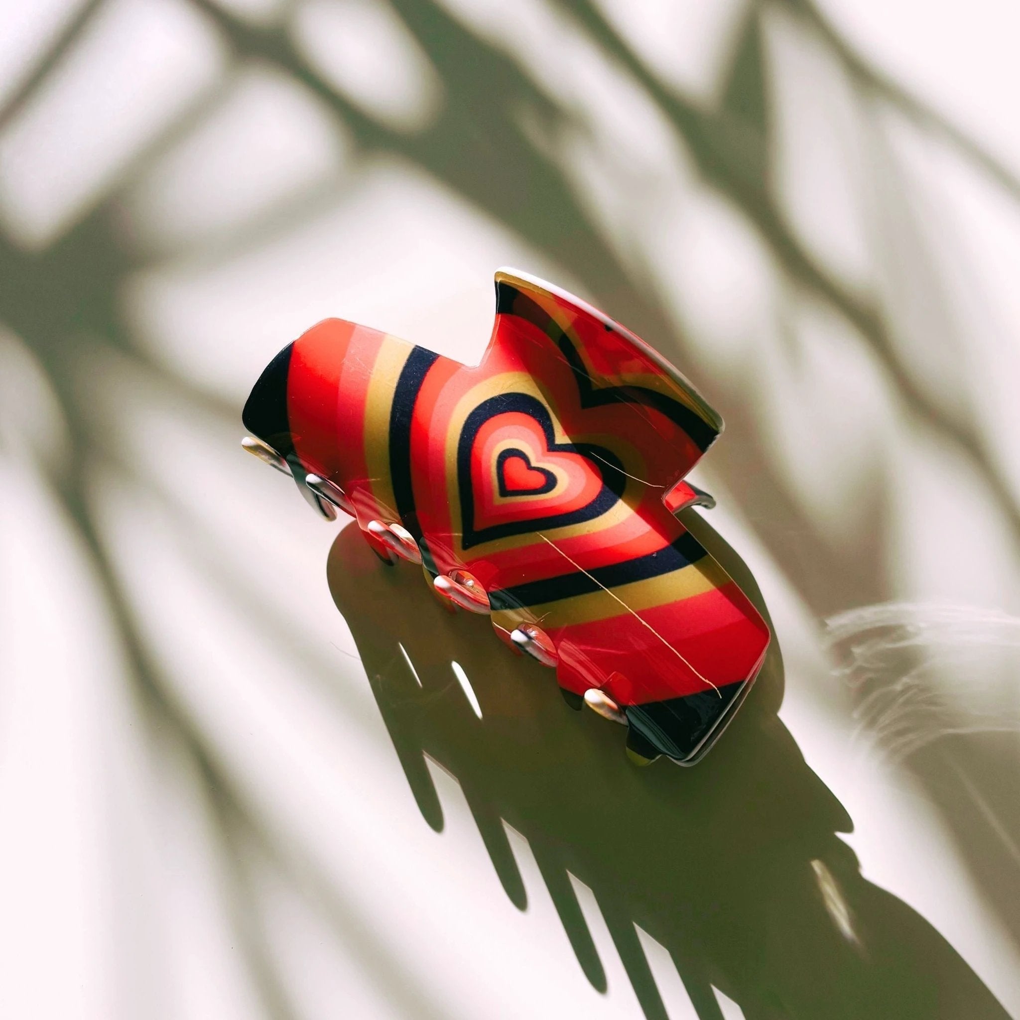 The Foxy in Warm ‘70s Sunrise Hair Claw | Hearts Claw Clip by The Bullish Store