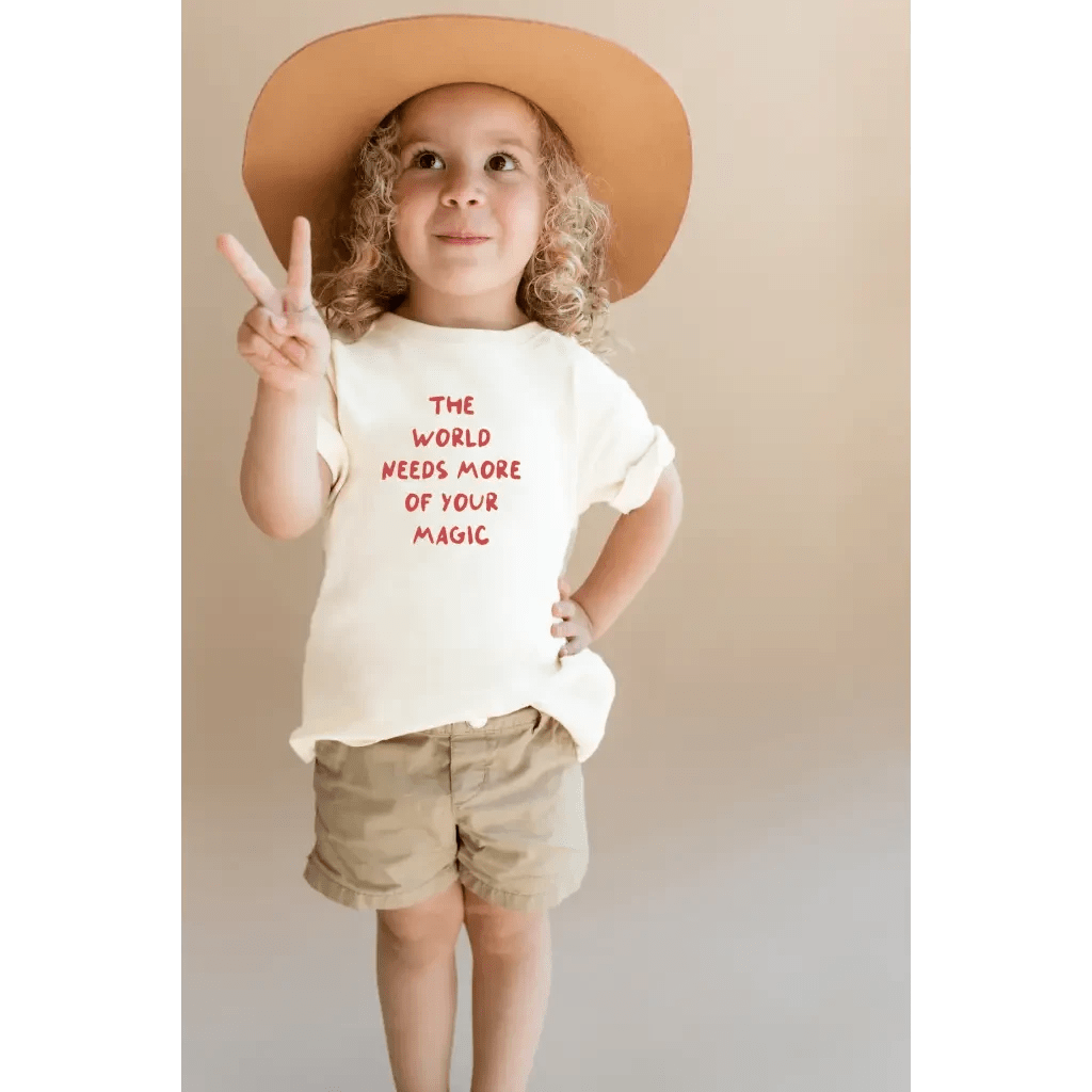 The World Needs More of Your Magic Kids Graphic T-Shirt by Polished Prints