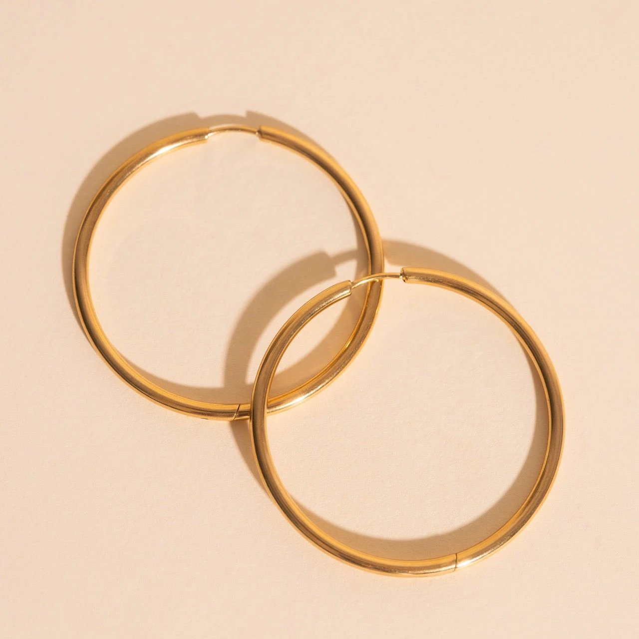 Titanium Circle Rounded Huggie Hoop Earrings by Oh Clementine