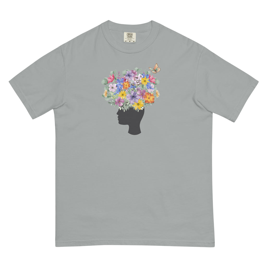 An image of the T-shirt with a graphic of a head with flowers coming out of the top