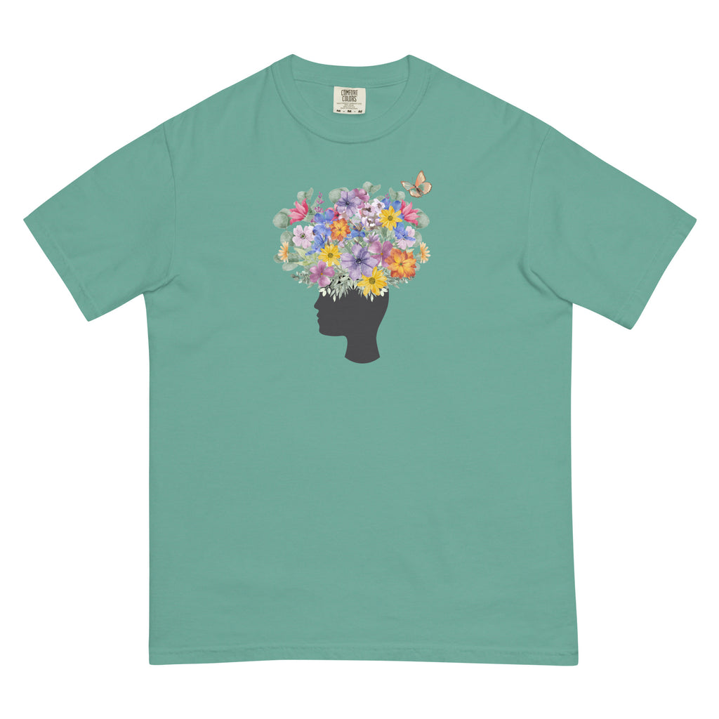 An image of the T-shirt with a graphic of a head with flowers coming out of the top