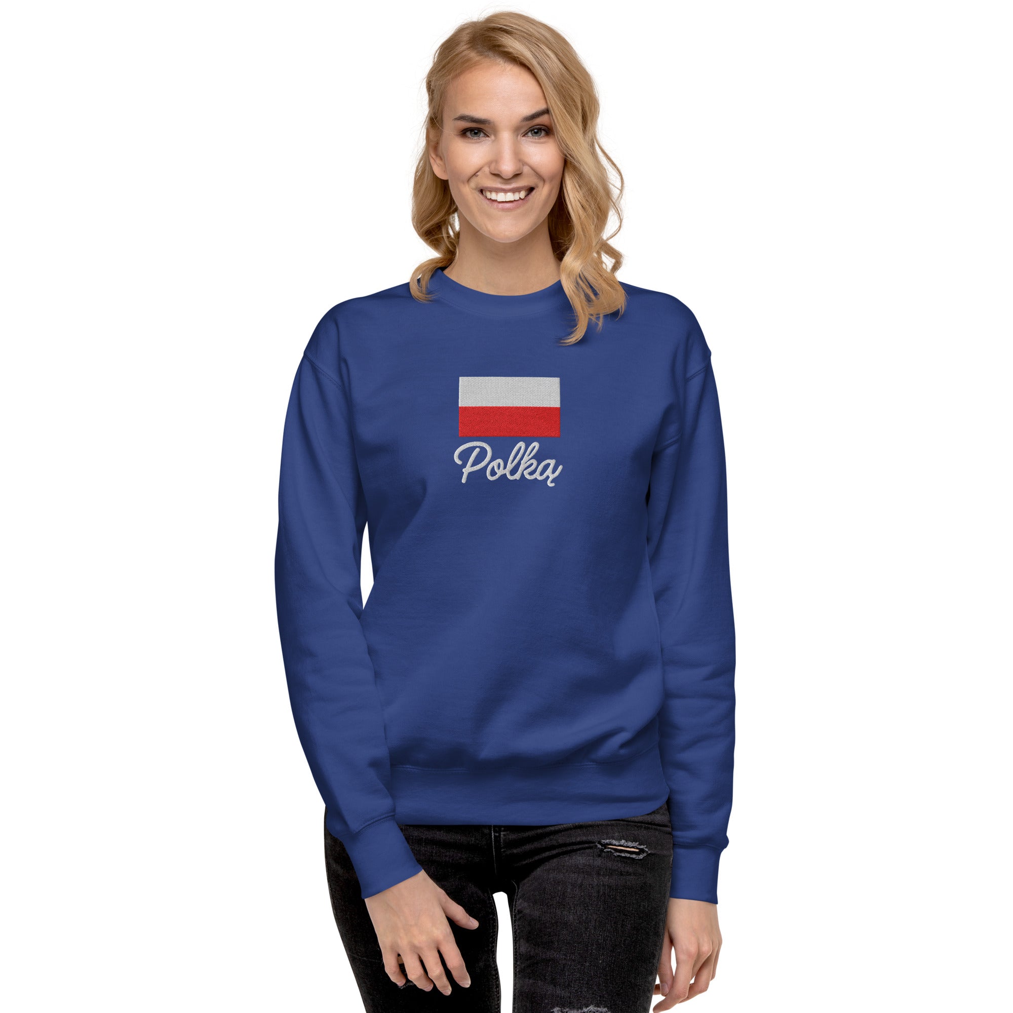 Royal blue crew neck sweatshirt modeled on person, featuring embroidered Polish flag in white and red colors above white embroidered text "Polka" in script font