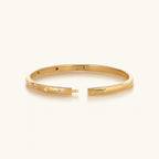 Unwavering Grace Gold Multi Symbol Bangle Bracelet