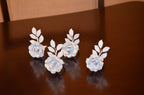 Vibhsa White Rose Set of 4 Napkin Rings by Vibhsa