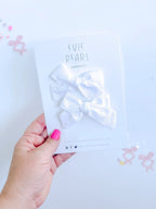 White Mini Solid Pinwheel Pigtail Bow Set by Evie Pearl Handmade