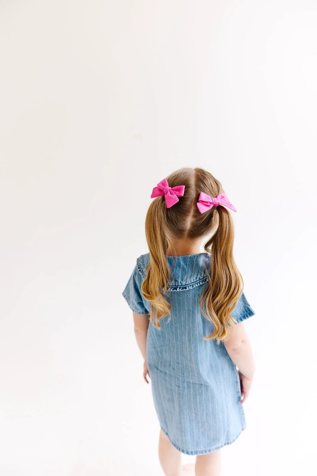 White Mini Solid Pinwheel Pigtail Bow Set by Evie Pearl Handmade