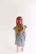 White Solid Medium Bow by Evie Pearl Handmade