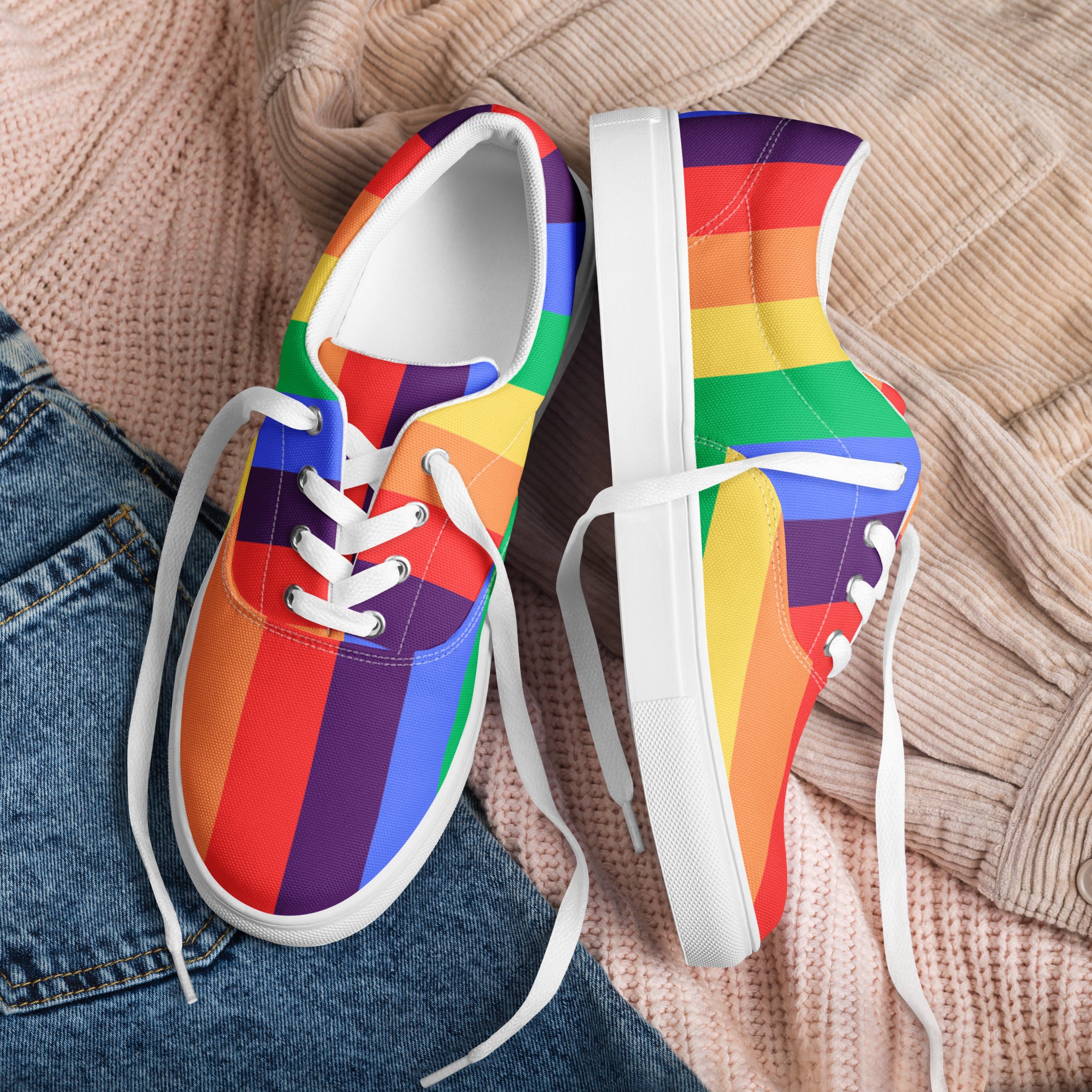 Product mockup of a pair of women's rainbow striped shoes with white soles and white laces