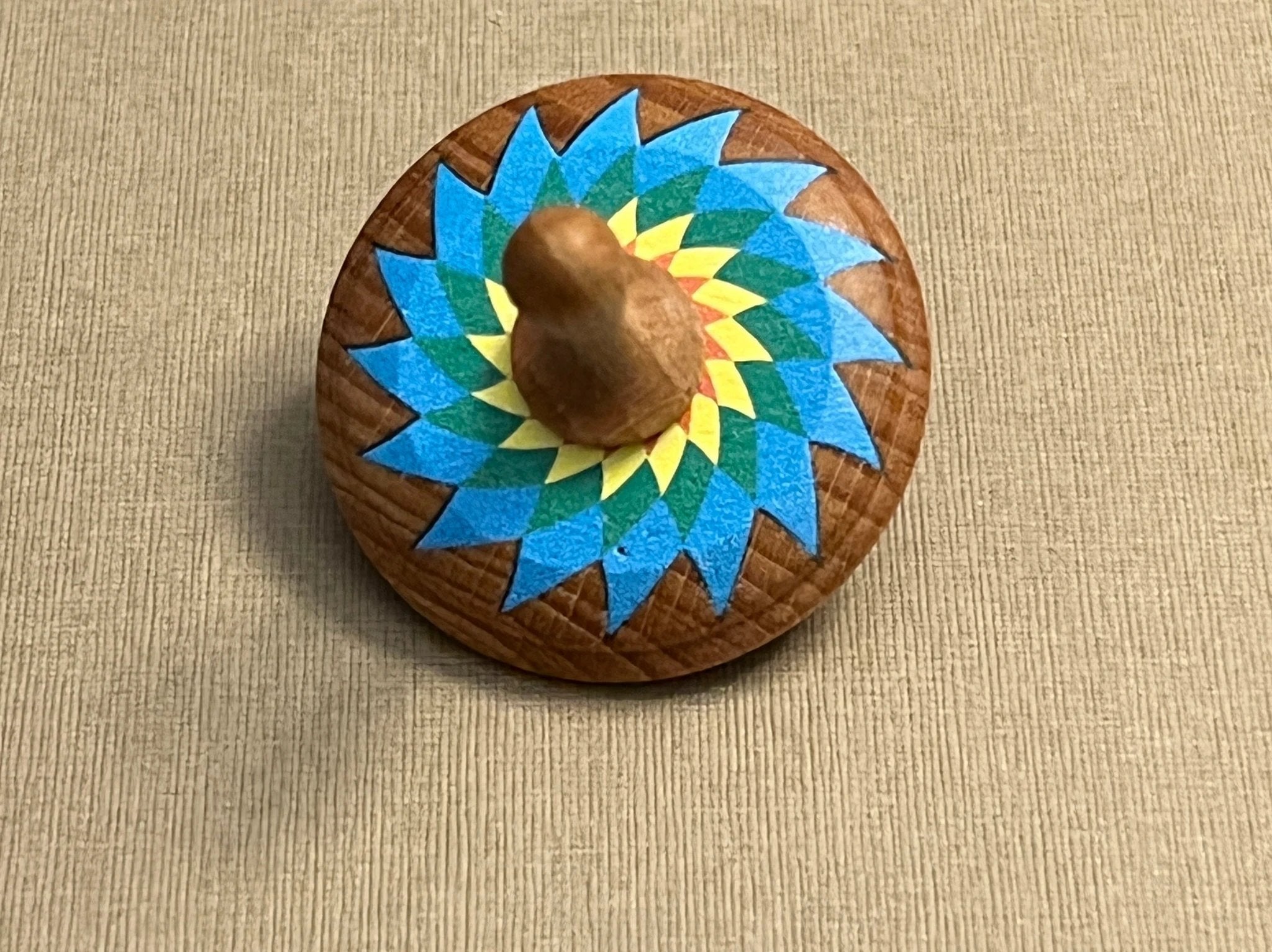 Wooden Spinning Top Toy painted by PoppyBabyCo