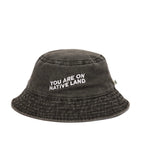 'YOU ARE ON NATIVE LAND' BUCKET HAT by Urban Native Era