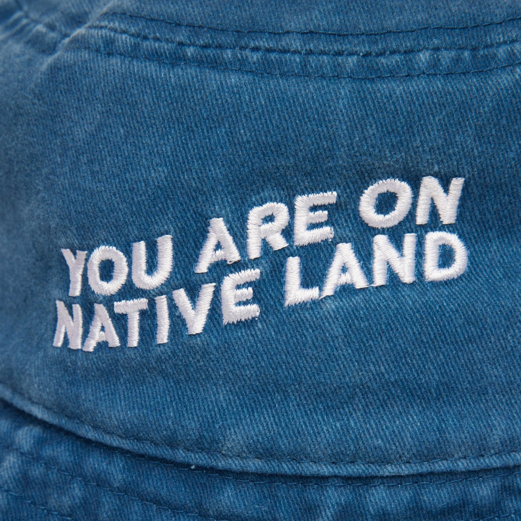 'YOU ARE ON NATIVE LAND' BUCKET HAT by Urban Native Era