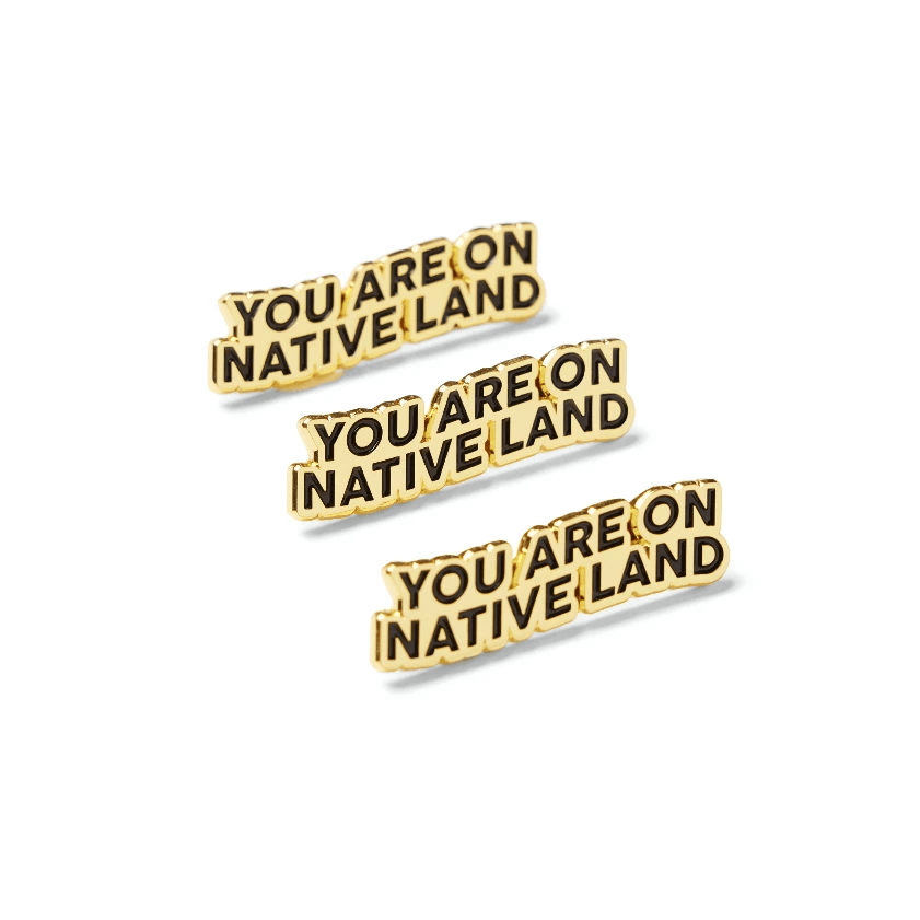 'YOU ARE ON NATIVE LAND' PIN - GOLD by Urban Native Era
