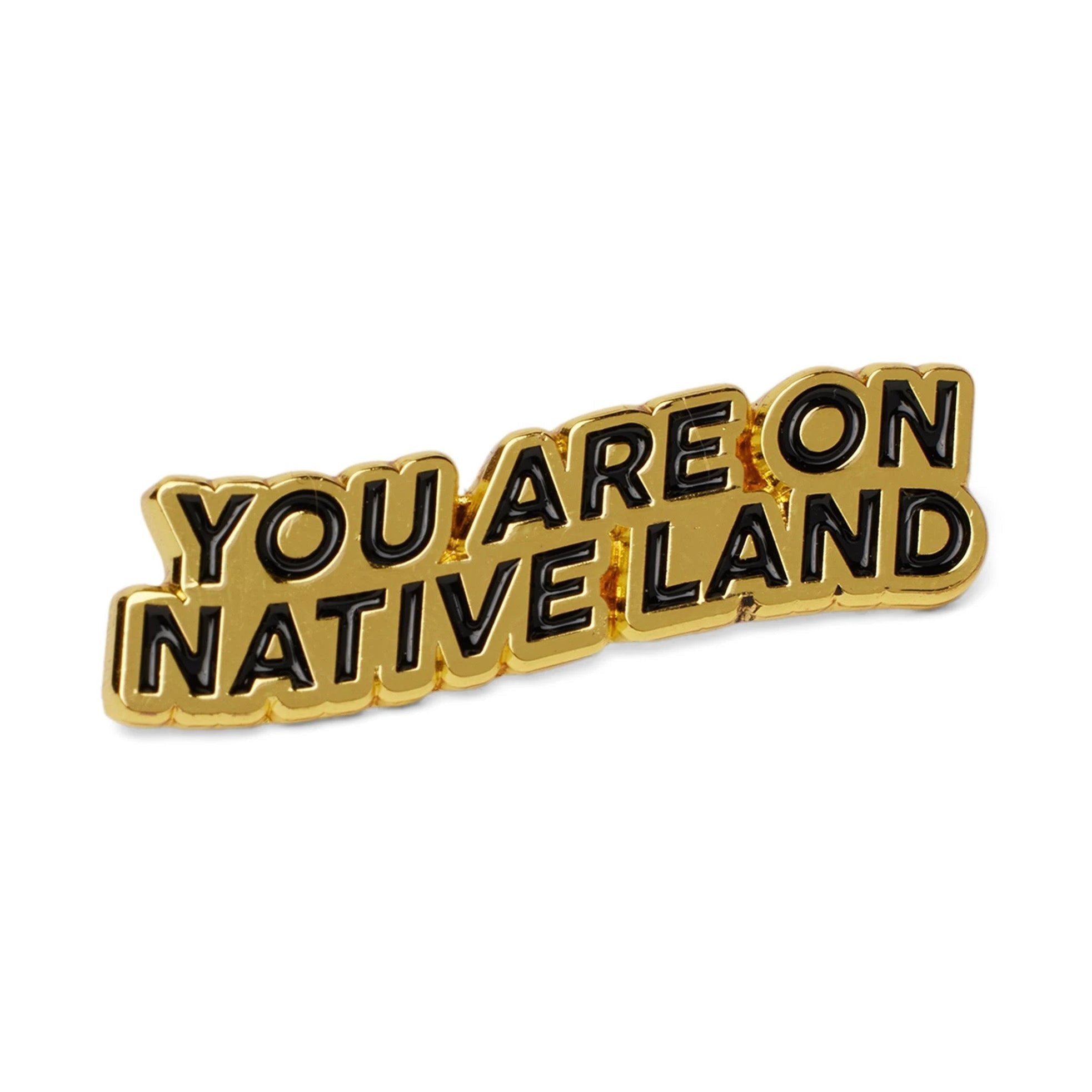 'YOU ARE ON NATIVE LAND' PIN - GOLD by Urban Native Era