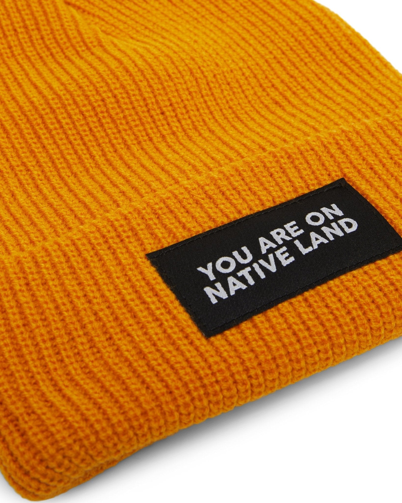 'YOU ARE ON NATIVE LAND' RIBBED BEANIE by Urban Native Era