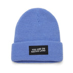 'YOU ARE ON NATIVE LAND' RIBBED BEANIE by Urban Native Era